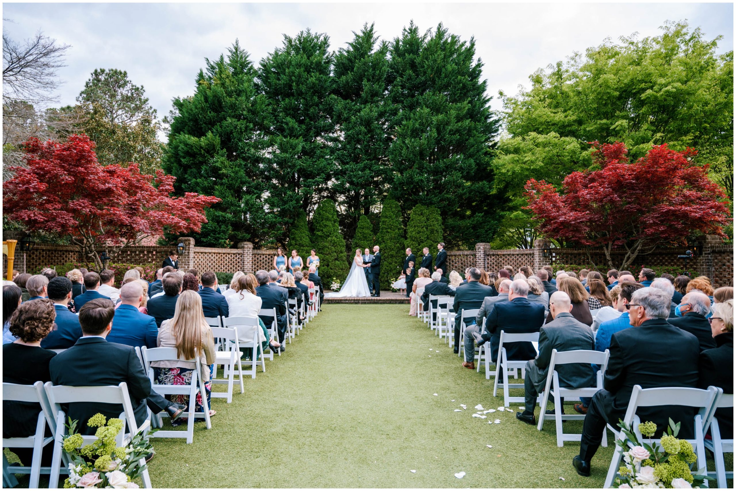 Outdoor wedding ceremony in the walled garden at The Sutherland