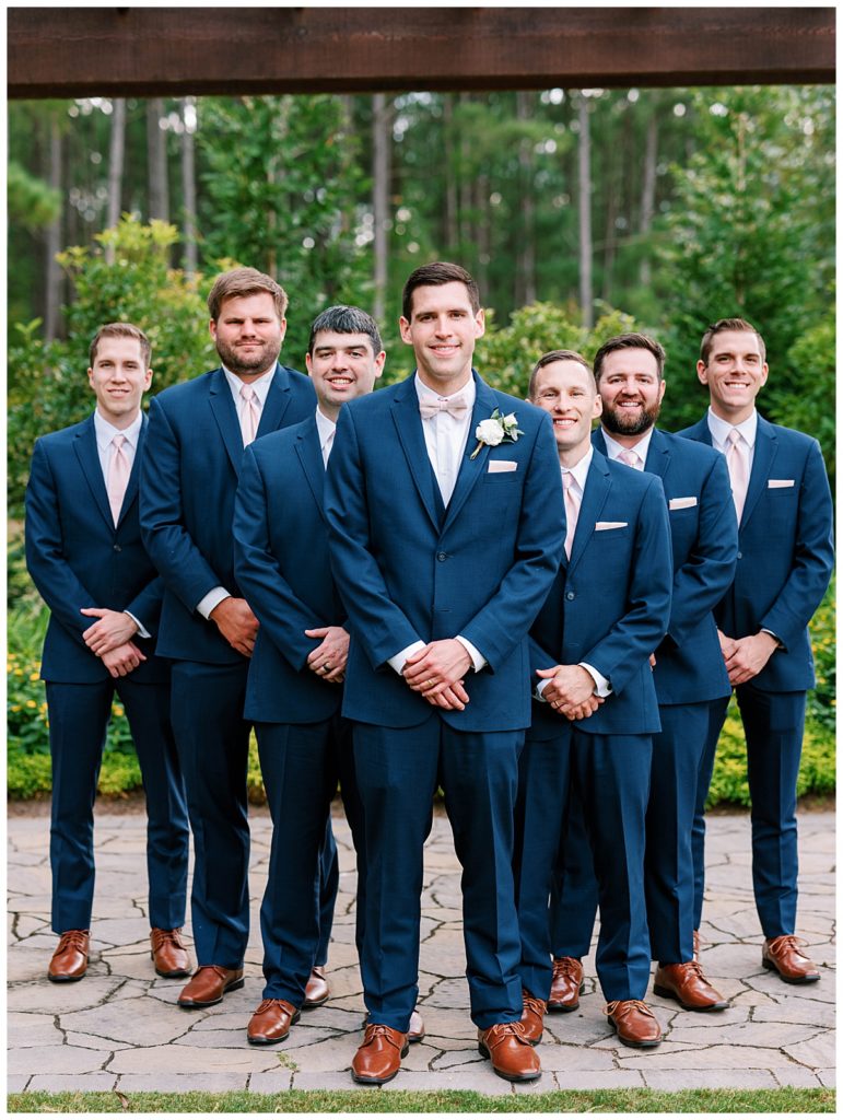 groomsmen taking a picture at The Pavillion of Carriage Farm