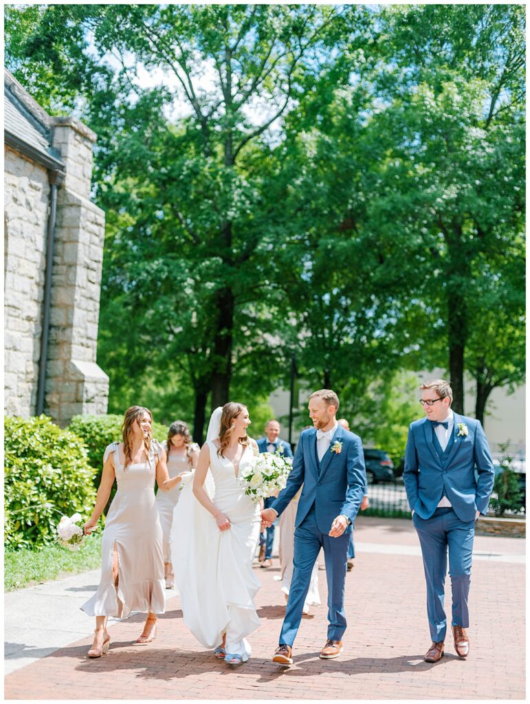Wedding Party walking after ceremony in Downtown Raleigh Sacred Heart Catholic Church