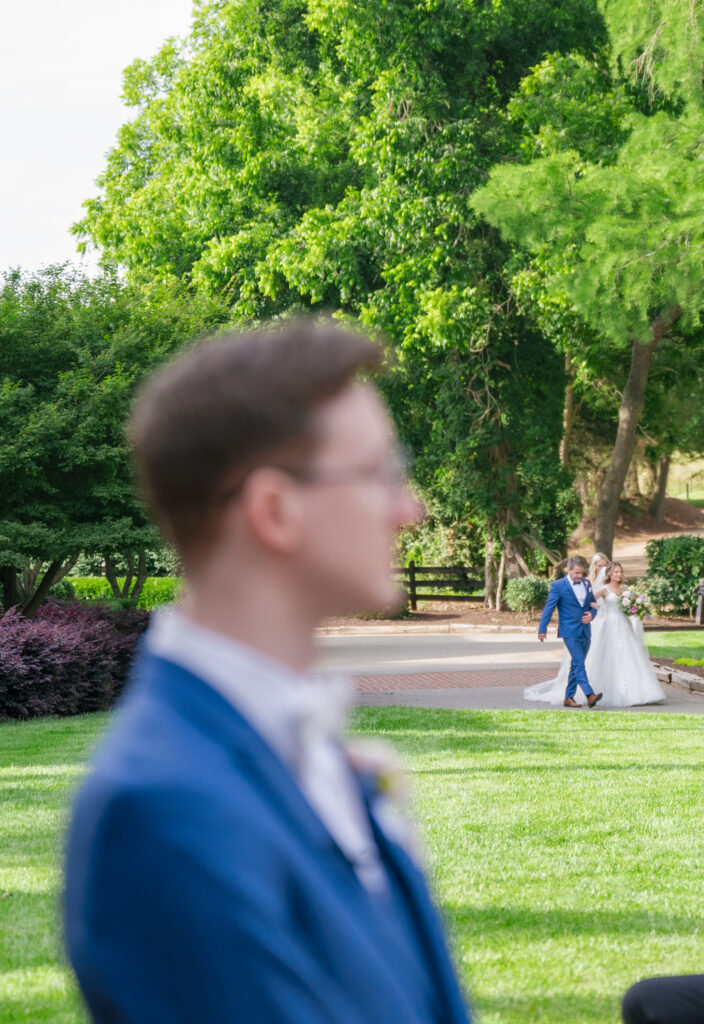 Groom waits for his bride to walk down the aisle