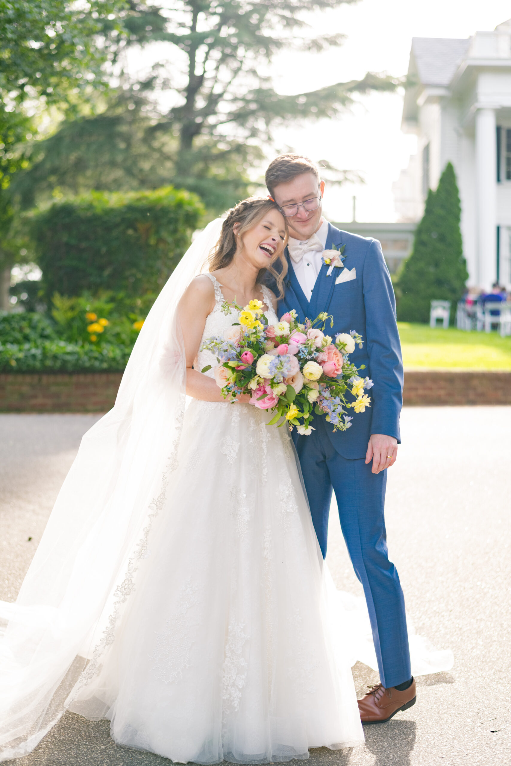 Bride and Groom celebrating with hugging and laughter after their ceremony ends at Rose Hill Estate